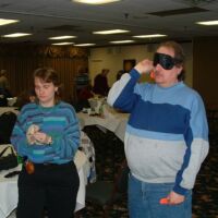 Kim watching Curt throw, 2003 tournament